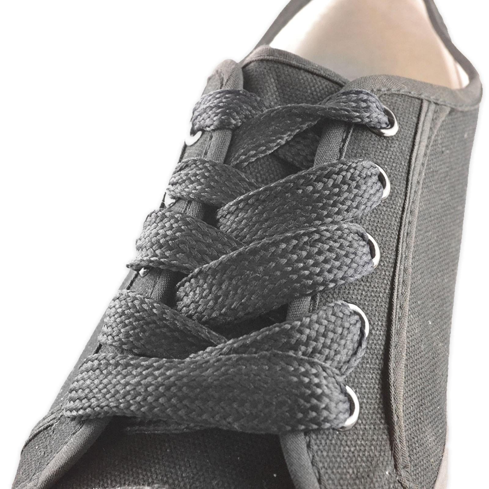 Close-up of a black canvas sneaker featuring Shoestring's Flat Block Badminton Shoe Laces in Black (140cm), highlighting the intricate lace pattern and the texture of the fabric.