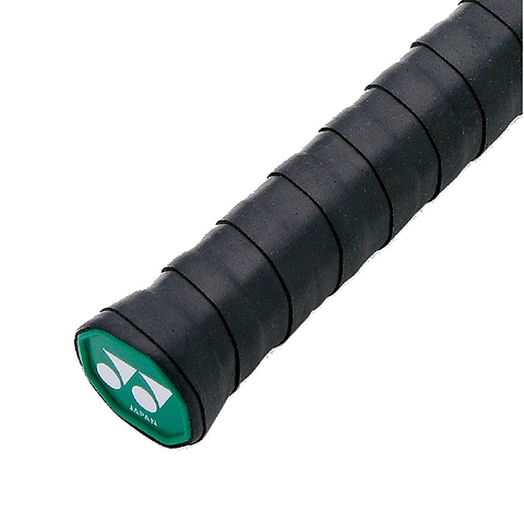 Close-up view of a black badminton racket handle, highlighting a green logo cap at the end with white symbols. The Yonex AC102EX Super Grap Badminton Overgrip - 3 Pack - Black offers textured grip tape for enhanced control, comfort, and sweat absorption while playing.
