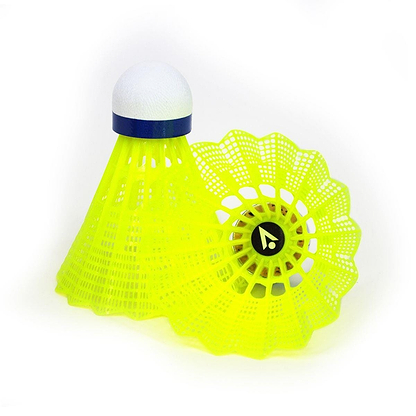 In the image, two of the Karakal National Natural Nylon Shuttlecocks from a set of six are depicted in bright yellow. One shuttlecock stands upright while the other rests on its side, revealing its natural cork base. The design showcases a distinctive mesh-like pattern accented by a band near the top, characteristic of Karakal's signature style.