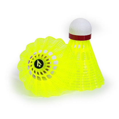 On a white background, two Karakal National Natural Nylon Shuttlecocks in bright yellow are displayed. One stands upright, while the other rests on its side, showcasing its cork base and open net-like design with a small logo inside—the perfect choice for casual play.