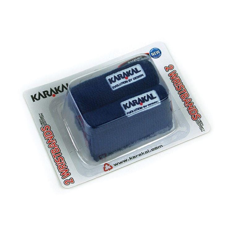 The packaging of the Karakal Badminton Wrist Band (Twin Pack) - Navy is displayed in a clear plastic container. Each wristband features an embroidered Karakal logo and is crafted from super absorbent cotton, ensuring comfort and performance. The package is labeled "2 WRISTBANDS.