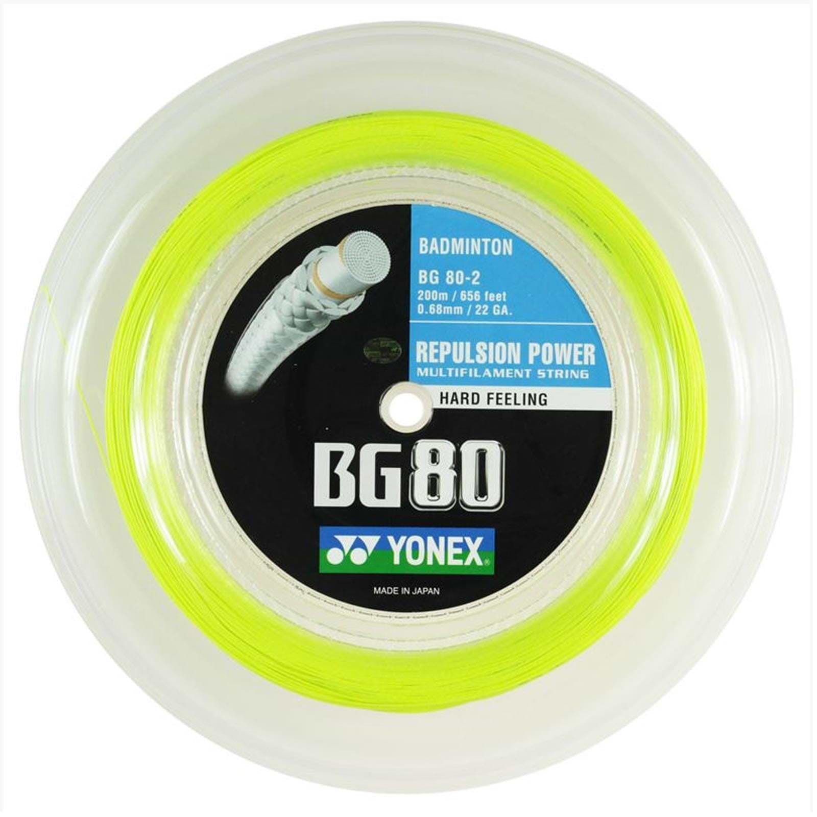 The Yonex BG 80 Badminton String Yellow reel features a vibrant neon yellow color and is renowned for its high repulsion power. It spans 200 meters (656 feet) with a thickness of 0.68 mm (22 gauge). The central label highlights "Repulsion Power" and "Hard Feeling," and it is manufactured in Japan by Yonex.