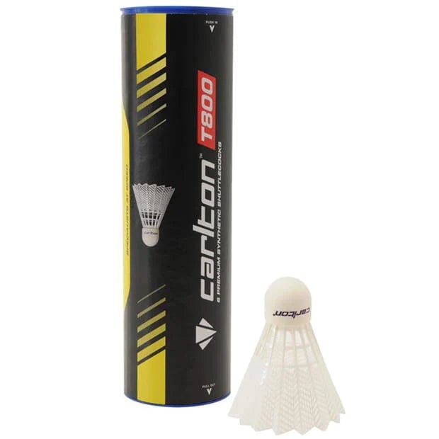 Next to a white synthetic badminton shuttlecock is a cylindrical tube labeled "Carlton T800 White Medium Badminton Nylon Shuttles / Shuttlecocks - Tube 6." The black tube, featuring yellow accents, is ideal for club use as it contains durable shuttlecocks designed for consistent play.