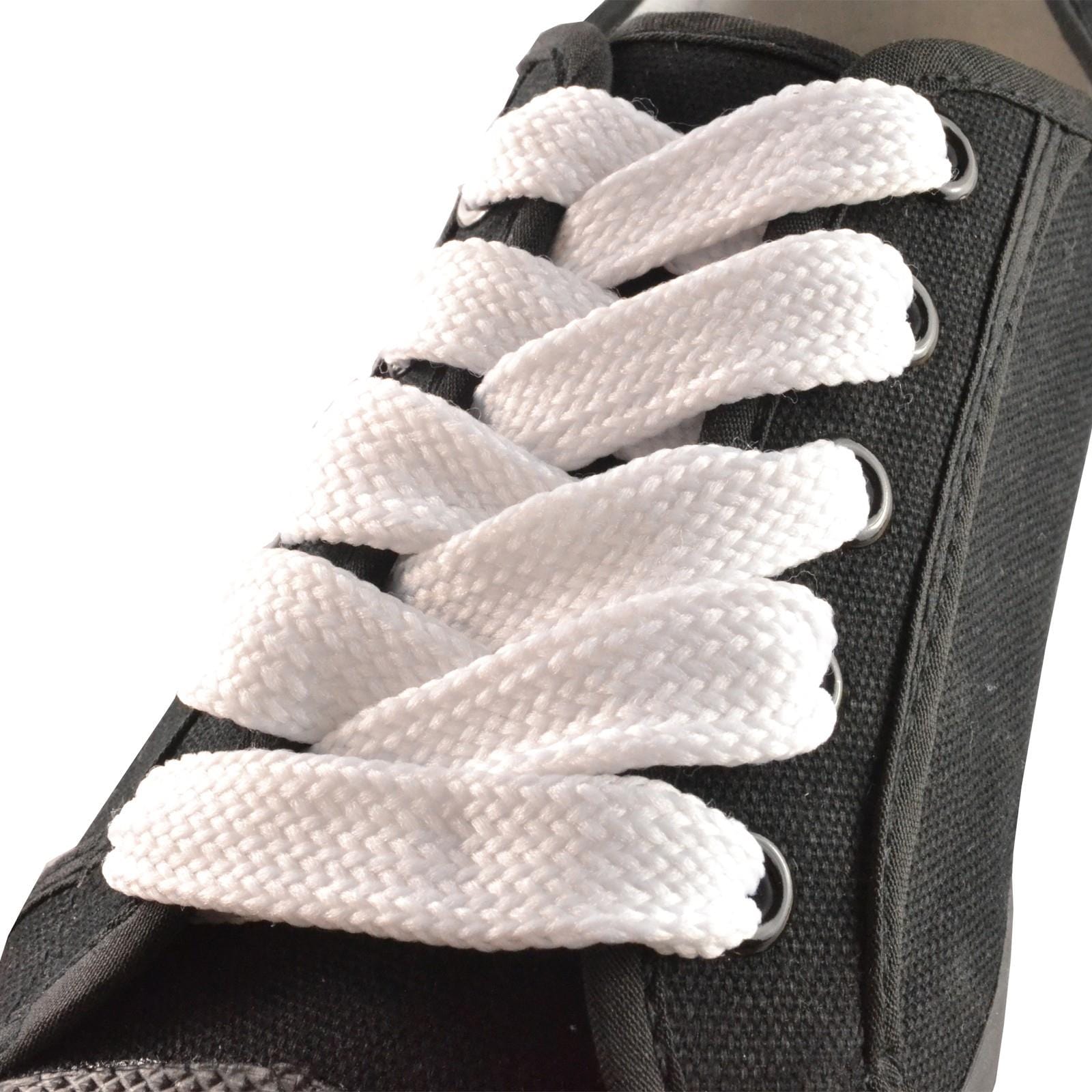 Close-up of a black sneaker with Shoestring's Flat Block Badminton Shoe Laces in white, neatly crisscrossed. These 140cm laces contrast sharply with the dark fabric and metal eyelets, adding a fresh touch to your favorite pair.
