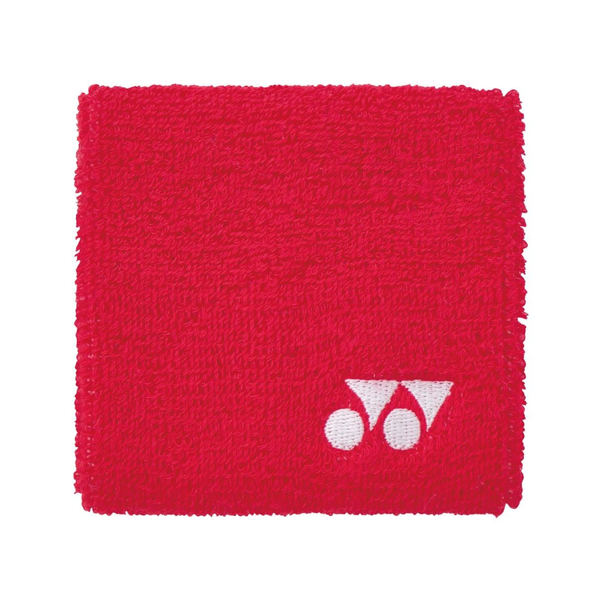 The Yonex AC493 Wristband - Red features a textured fabric surface and a small white geometric logo in the bottom right corner, designed to keep you cool and dry.