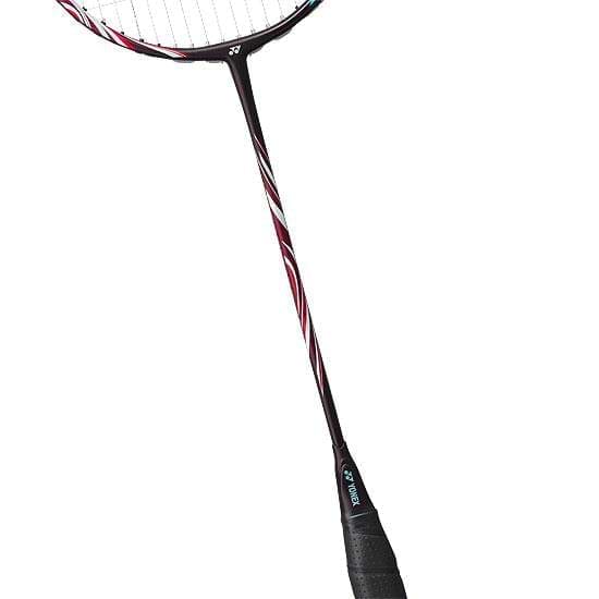 The Yonex Astrox 100 Tour 4U Kurenai Badminton Racket - Red showcases a striking red design with white accents along the shaft. Its black grip handle enhances the head-heavy balance of this Yonex racket, ensuring powerful swings.