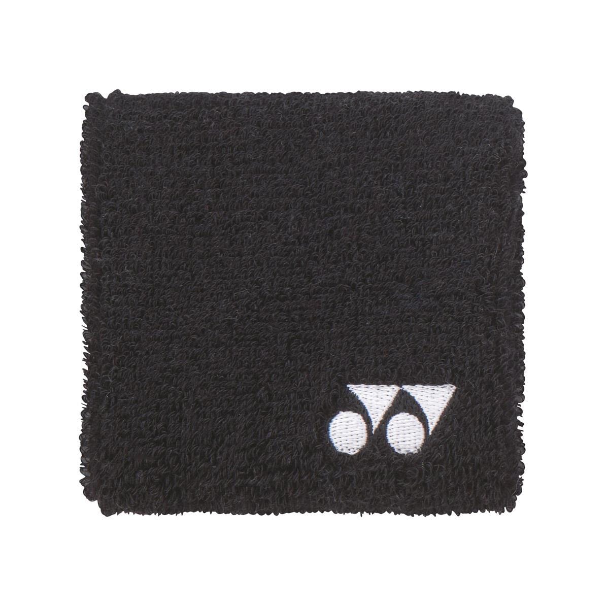 The Yonex AC493 Wristband in black is ideal for on-court activities, showcasing a small white logo in the corner against a plain white backdrop. Its soft and absorbent texture makes it the perfect sports accessory.