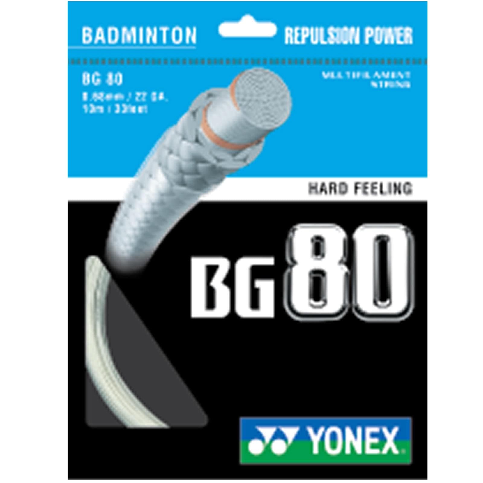 The Yonex BG 80 Badminton String package highlights a white string with the terms "Hard Feeling" and "Repulsion Power." Its blue and white design, featuring the Yonex logo at the bottom, emphasizes its high-modulus Vectran fiber and multifilament core construction.
