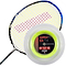 A badminton racket with a yellow and white string pattern rests beside a 200m reel of Ashaway Zymax 64 TX Badminton String, featuring ZyWeave technology for enhanced durability. This neon yellow string is crafted from BETA polymer fibers, promising exceptional performance. The circular spool prominently displays the product details.