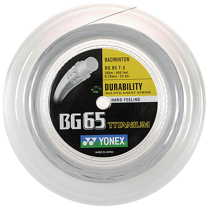 A detailed view of a package containing the Yonex BG 65 Ti badminton string, featuring a durable design with high-quality nylon fibers and a multifilament core, delivering a hard feel. The strings have a gauge of 0.70 mm and span 200 m in length, ensuring top-tier performance made in Japan.