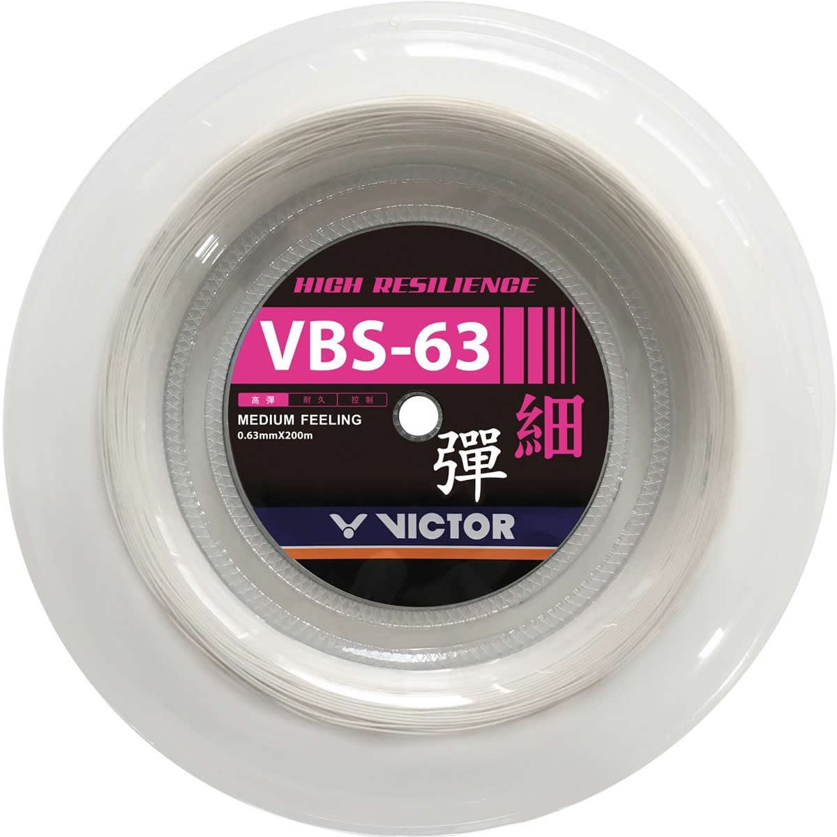 The image showcases a reel of Victor VBS 63 Badminton String, prominently featuring the terms "High Resilience" and "Medium Feeling" on its label. This durable multifilament string, under the Victor brand, has a thickness of 0.63 mm and spans 200 m, neatly enclosed in clear plastic packaging.