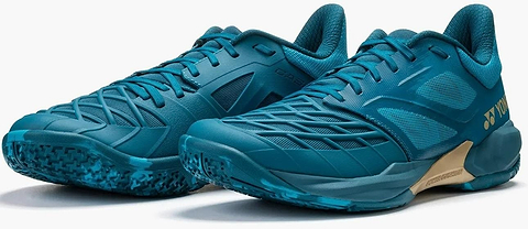 A pair of Yonex Power Cushion Cascade Drive 3 Unisex Badminton Shoes in Peacock Blue with textured soles and a low-cut design, displayed side by side on a white background.