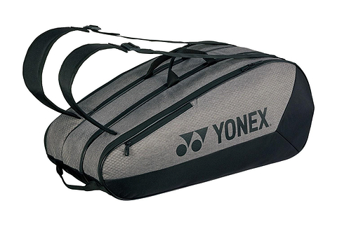 The Yonex 42529EX Team 9 Racket Badminton Bag in grey and black, a large twin-compartment bag shown with shoulder straps and the Yonex logo across the side.
