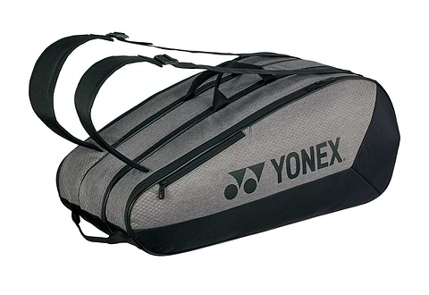 The Yonex 42529EX Team 9 Racket Badminton Bag in grey and black, a large twin-compartment bag shown with shoulder straps and the Yonex logo across the side.