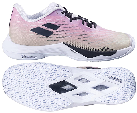 The Babolat Shadow Tour 5 Womens Badminton Shoes in pink and green feature a textured white sole with black geometric cutouts for superior indoor court grip, shown from the side and bottom, with black laces and the Babolat logo.