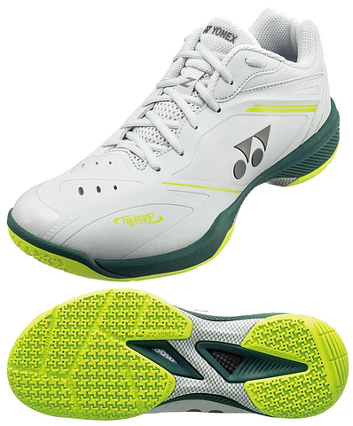 The Yonex Power Cushion 65Z4 Viktor Axelsen Men’s Wide Badminton Shoes in White/Lime feature a textured sole for grip, Yonex branding, and design accents inspired by Viktor Axelsen. One shoe is shown from the side, the other from below.
