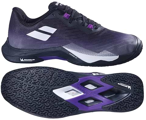 The Babolat Shadow Tour 5 Womens Badminton Shoes in black and purple are shown, highlighting a side view and a Michelin-branded textured sole. Ideal as badminton court shoes.