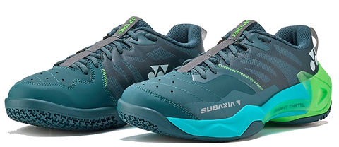 The Yonex Subaxia GT WIDE 2026 Unisex Badminton Shoes in dark green feature Power Cushion Rev technology, gray laces, SUBAMA branding, and the Yonex logo—a dynamic and modern design for comfort on the court.