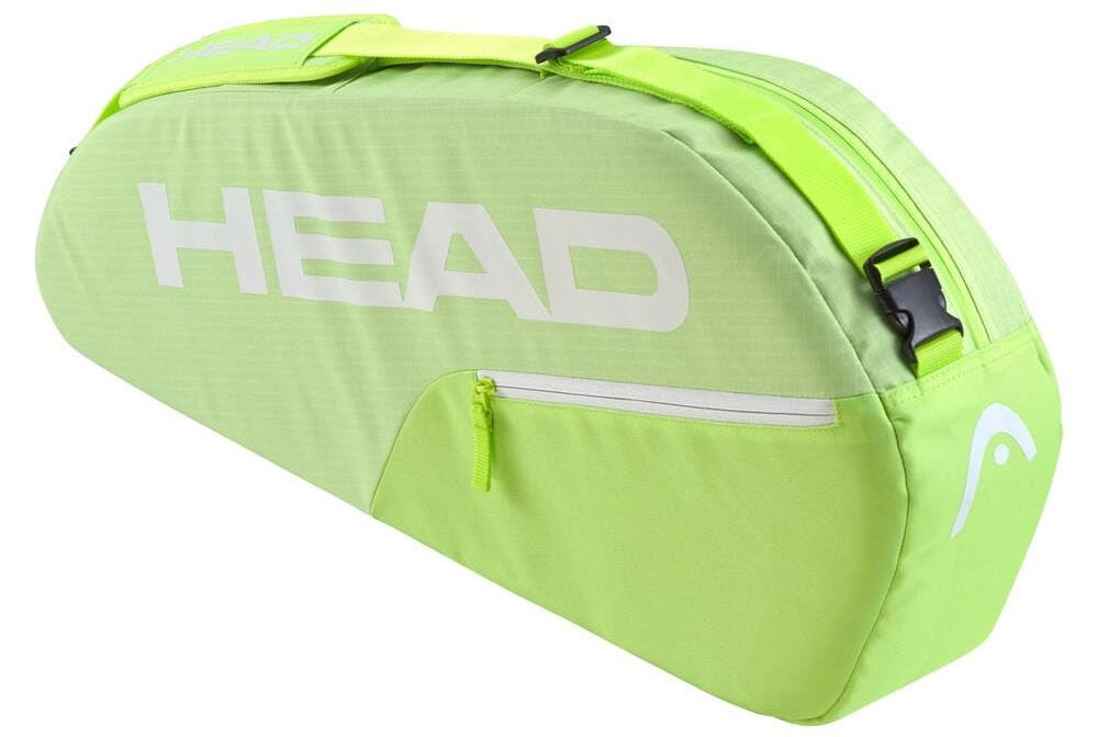 The HEAD BASE 3 Racket Badminton Bag S - SG is lime green with "HEAD" in white letters. It has a side zipper pocket, an adjustable shoulder carry system, sleek rounded design, and reinforced construction, ideal for carrying racquets and gear.