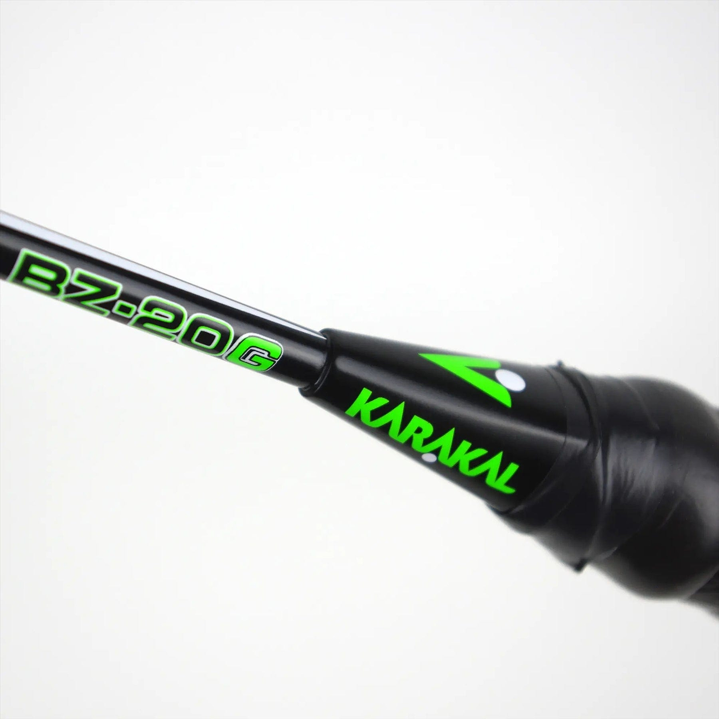 The Karakal Black Zone BZ 20 2.1 Badminton Racket features a black grip handle and an "BZ-20G" shaft in bright green, reflecting design excellence. Its isometric head ensures enhanced precision with every shot.