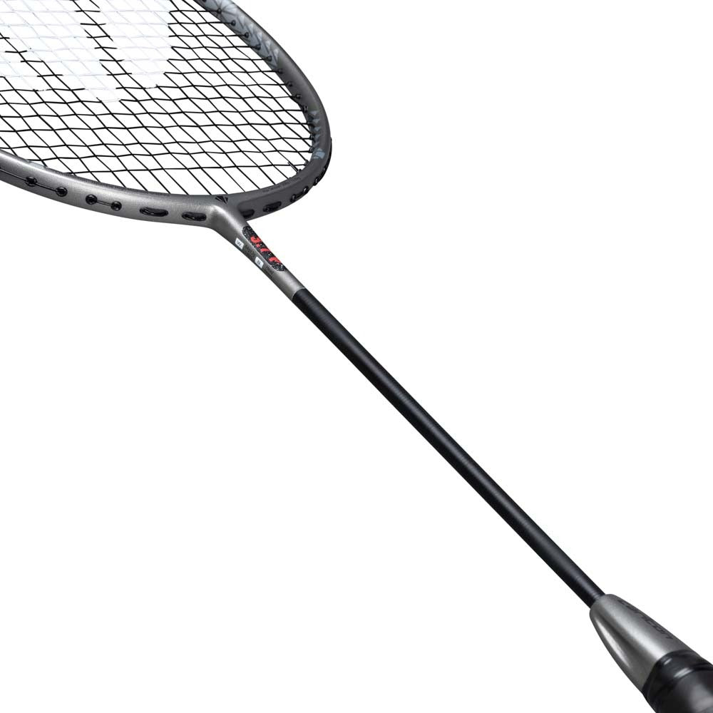 A close-up of the Carlton 3.7P G6 4U Badminton Racket in grey by Carlton, featuring a black handle and a grey power frame, with detailed views of the strings and part of the shaft set against a white background.