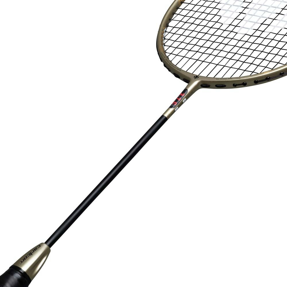 A close-up view of the Carlton 3.7C G6 4U Badminton Racket - Gold from Carlton highlights its black handle, slim shaft, and head with a striking gold frame and tightly strung strings against a white background—an expertly crafted control-focused badminton racket ideal for advanced players.