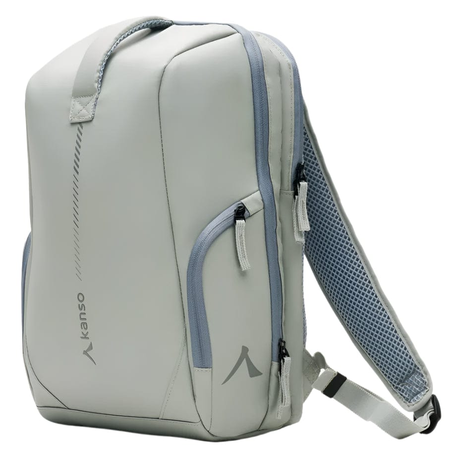 The Kanso Intuko Badminton 23L Backpack in grey is sleek and minimalist, featuring the Kanso logo, handles, multiple zippered compartments, and adjustable shoulder straps with mesh padding.