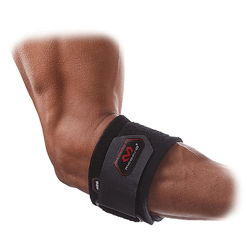 A person's arm is shown wearing the McDavid Adjustable Tennis Elbow Strap, displaying its logo. The strap provides compression to ease tendon pressure. With a dark skin tone, the individual showcases the black brace, which is adjustable via a velcro strap to offer support for tennis elbow.