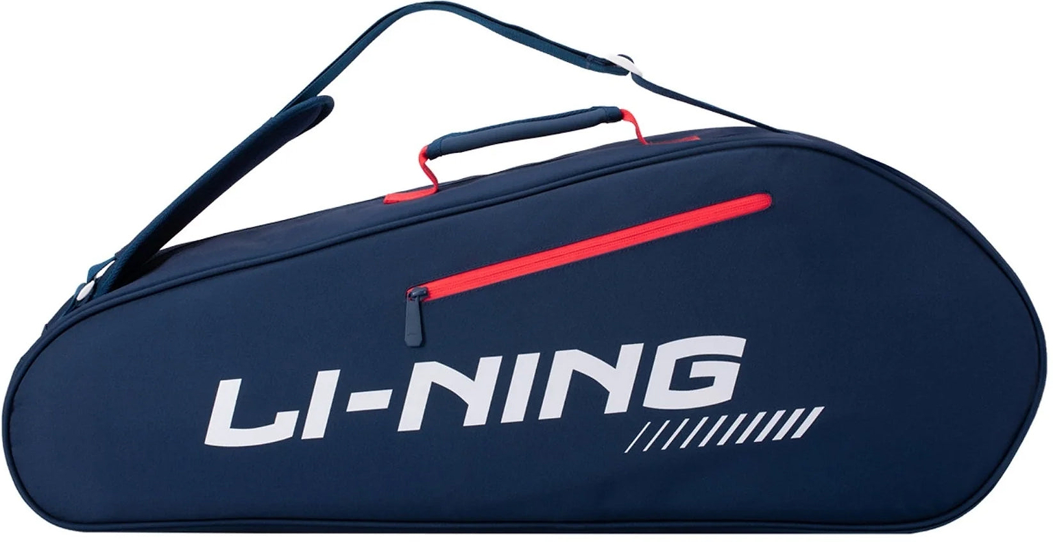 The Li-Ning Training Series 3 Racket Badminton Bag in blue and red features a prominent white Li-Ning logo, a convenient handle and shoulder strap, and a practical red zippered pocket—making it the perfect choice for carrying all your sports essentials in style.