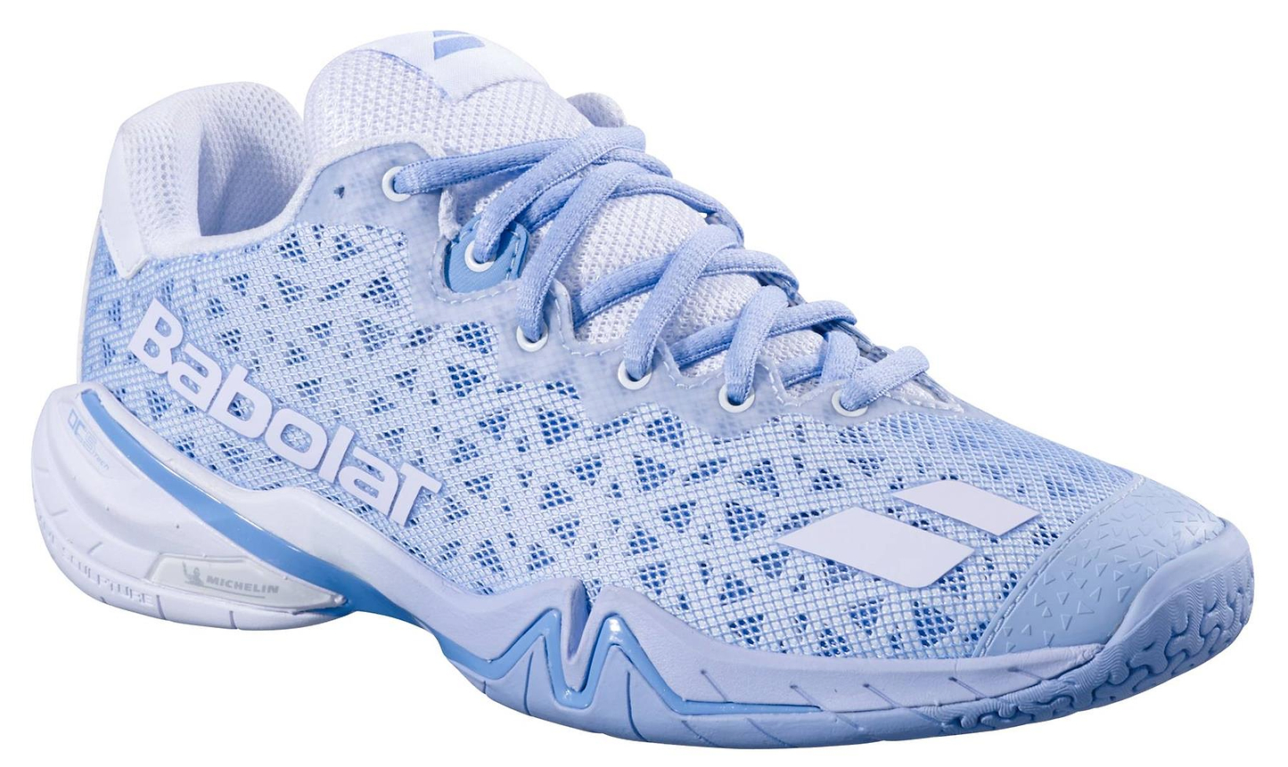 The Babolat Shadow 4 Womens Badminton Shoes in Snow Blue feature white accents, mesh fabric, white laces, and a textured sole, perfect for sports activities.