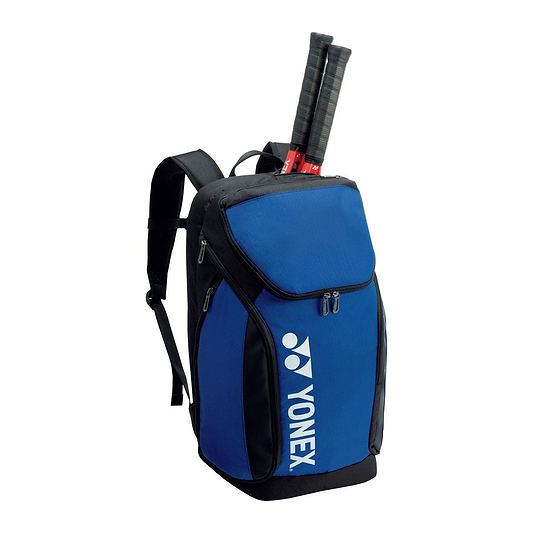 The Yonex 92412LEX Pro Badminton Backpack in cobalt blue is ideal for badminton enthusiasts, offering a 34L capacity and a dedicated racket storage compartment. With two racquets visibly extending from the top, it includes a zippered main compartment and convenient side pockets for all your badminton essentials.