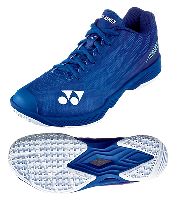 The Yonex Power Cushion Aerus Z2 Women's Badminton Shoes in Navy Blue are designed for agility, featuring a sleek design with the Power Cushion logo and a textured white sole with detailed tread for optimal grip, ideal for quick maneuvers on the court.