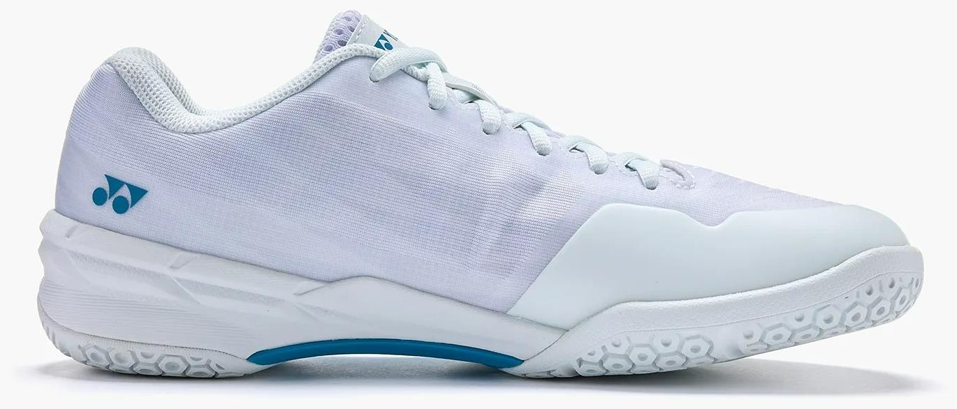 The Yonex Power Cushion Aerus X2 Unisex Badminton Shoes feature a white design with light blue accents, a textured sole, blue heel logo, white laces, and a lightweight low-top build for comfort on indoor courts.