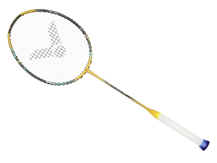 A gold Victor Thruster F C Ultra X badminton racket from Victor, designed for power and control with a white grip, photographed on a plain white background.