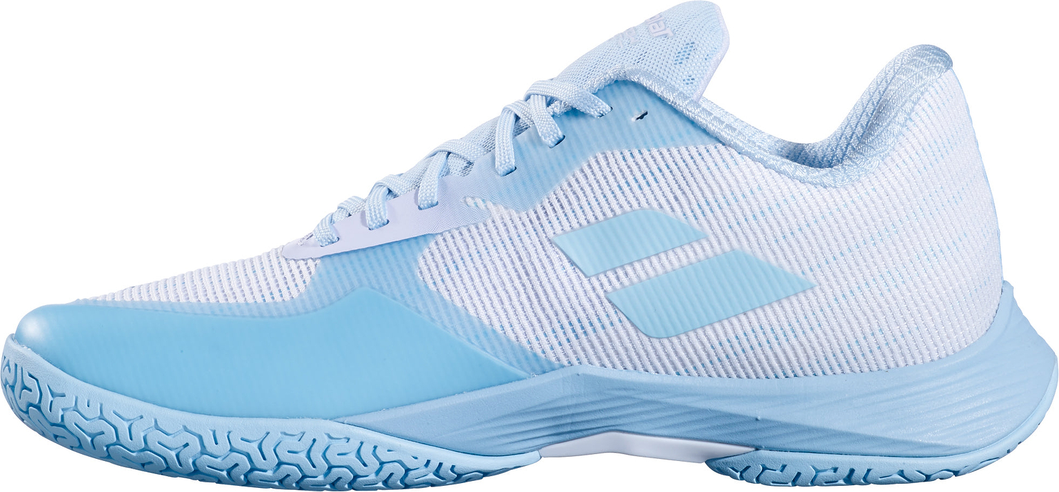 Introducing the Babolat Shadow Spirit 2 Womens Badminton Shoes in white and blue, featuring a breathable mesh upper, signature textured Michelin outsole, and two diagonal blue stripes on the side, displayed in a side view on a white background.