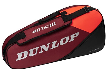 The Dunlop CX Performance 3 Badminton Racket Bag in a black and red color scheme is displayed. It includes an orange top section, the Dunlop logo in white letters on the side, and an adjustable shoulder strap for convenient carrying.