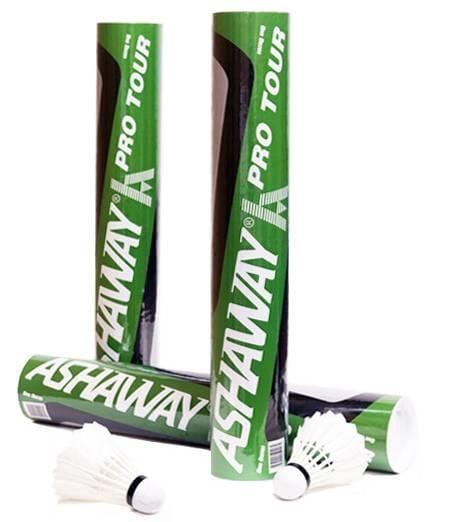 Three Ashaway Pro Tour Feather Badminton Shuttles tubes are shown—two upright, one lying down—with two white feather shuttlecocks in front, emphasizing the durability and quality of this premium Ashaway set of 12.