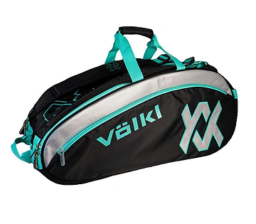 The Volkl Combi 6 Racket Badminton Bag in black and turquoise is a roomy tennis bag equipped with a large zippered compartment. It features turquoise straps, the "Volkl" brand name, and an eye-catching geometric logo on the side. The bag's thermal climate-controlled lining offers optimal protection for your gear in any weather.