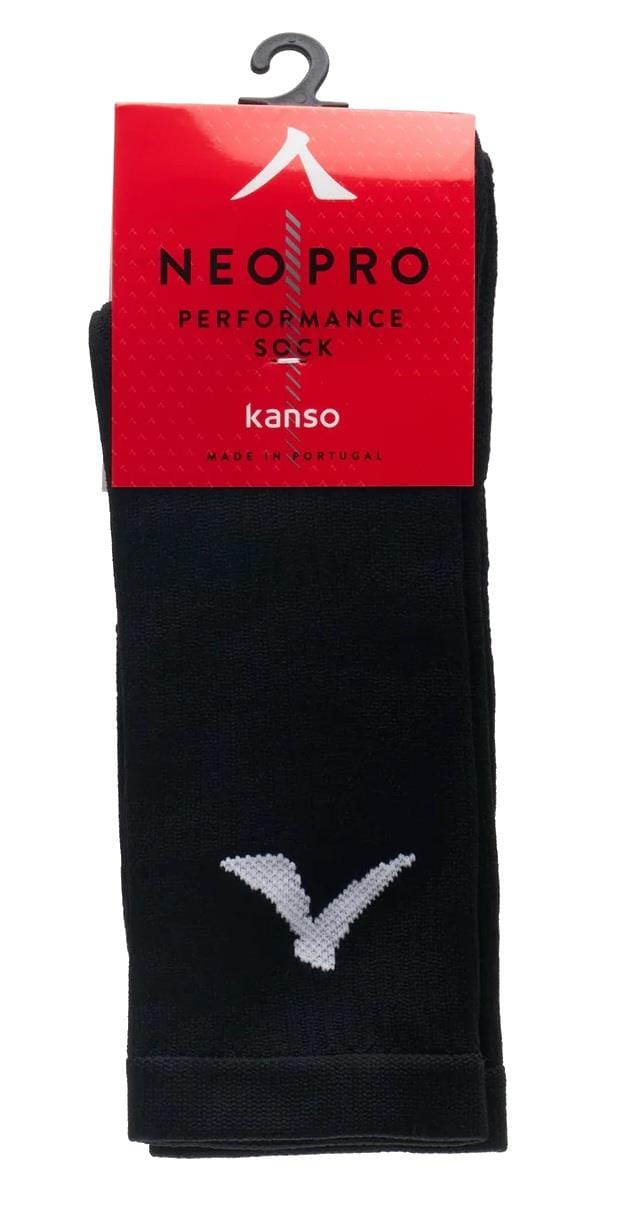 A pair of Kanso Neo Pro Performance Crew Badminton Socks in black with a white geometric toe design, featuring advanced ventilation for breathability. The red packaging reads "NEO PRO Performance Sock by Kanso," and they are made in Portugal.