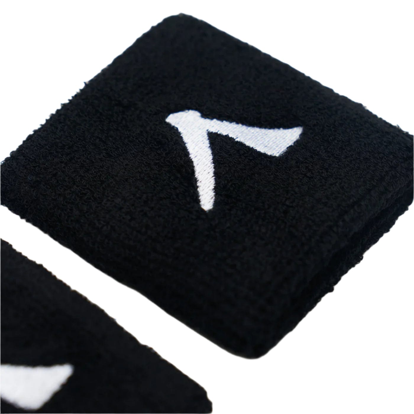 Black towel with a white design resembling an "A" or arrowhead, made from absorbent fabric for comfort. A close-up reveals part of another similar towel, echoing the sleek style of Kanso's 7cm Wristband in black.