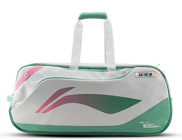 The Li-Ning Competition 6 Racket Badminton Bag in white and green features pink accents, a modern abstract design, sturdy handles, a zipper closure, and a small multicolored tag near the top right corner.