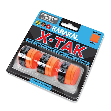 The packaging for the Karakal X-TAK 3 Pack Badminton Overgrips in orange prominently displays the brand name "Karakal" on vibrant orange grip strips. It features specifications such as a "0.6mm - SRF Surface" for excellent tackiness, along with attributes like "Touch," "Pad," and a "Universal Length" ideal for badminton overgrips.
