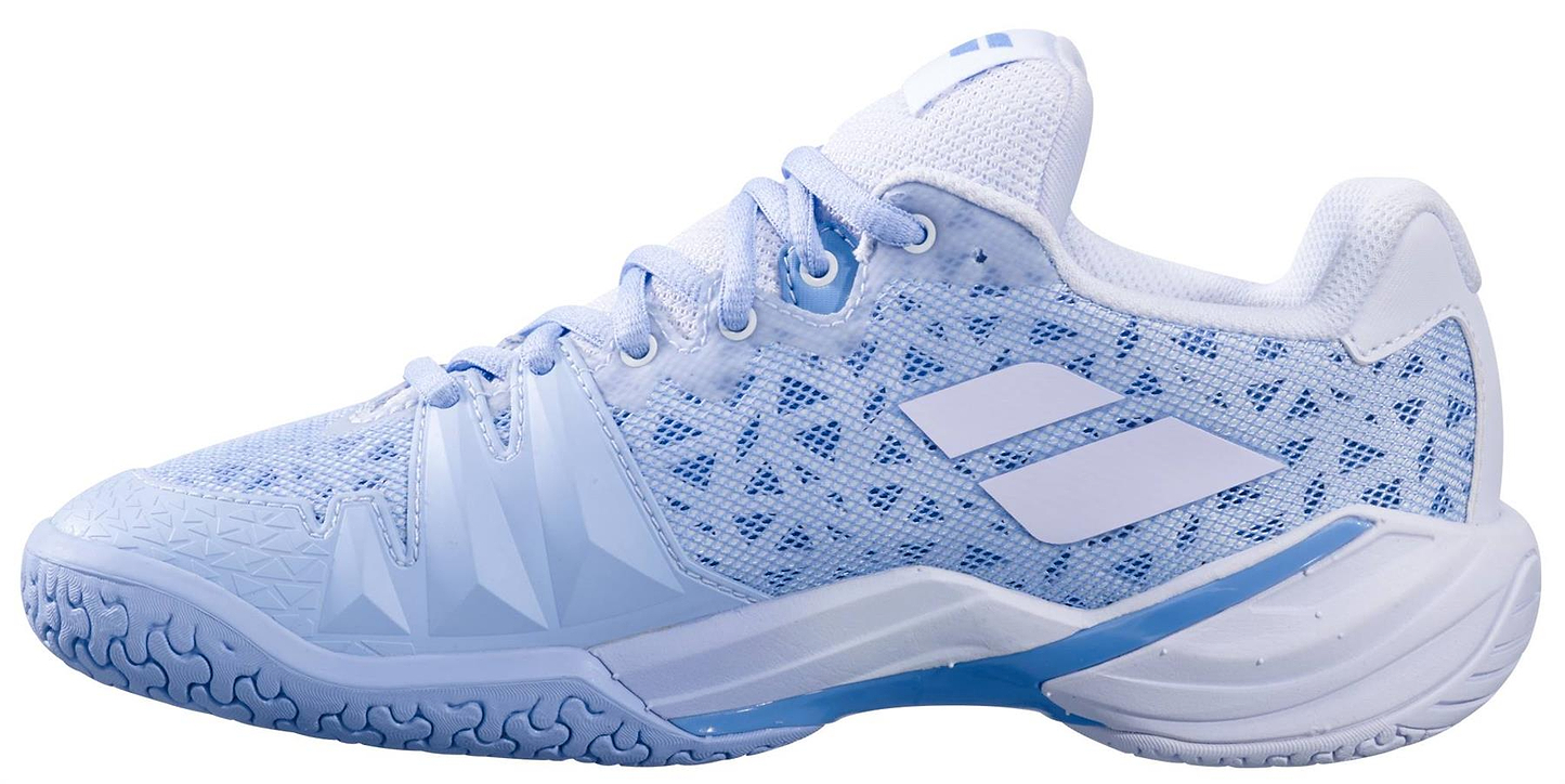 The Babolat Shadow 4 Womens Badminton Shoes - Snow Blue by Babolat feature a snow blue and white design, mesh upper, textured sole, and geometric side patterns with two white diagonal stripes as the brand's signature logo.