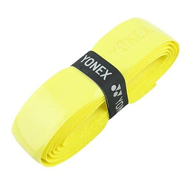 A coiled yellow Yonex AC420 Hi Soft Badminton Overgrip, secured by a black band with the Yonex logo and text, provides exceptional comfort.