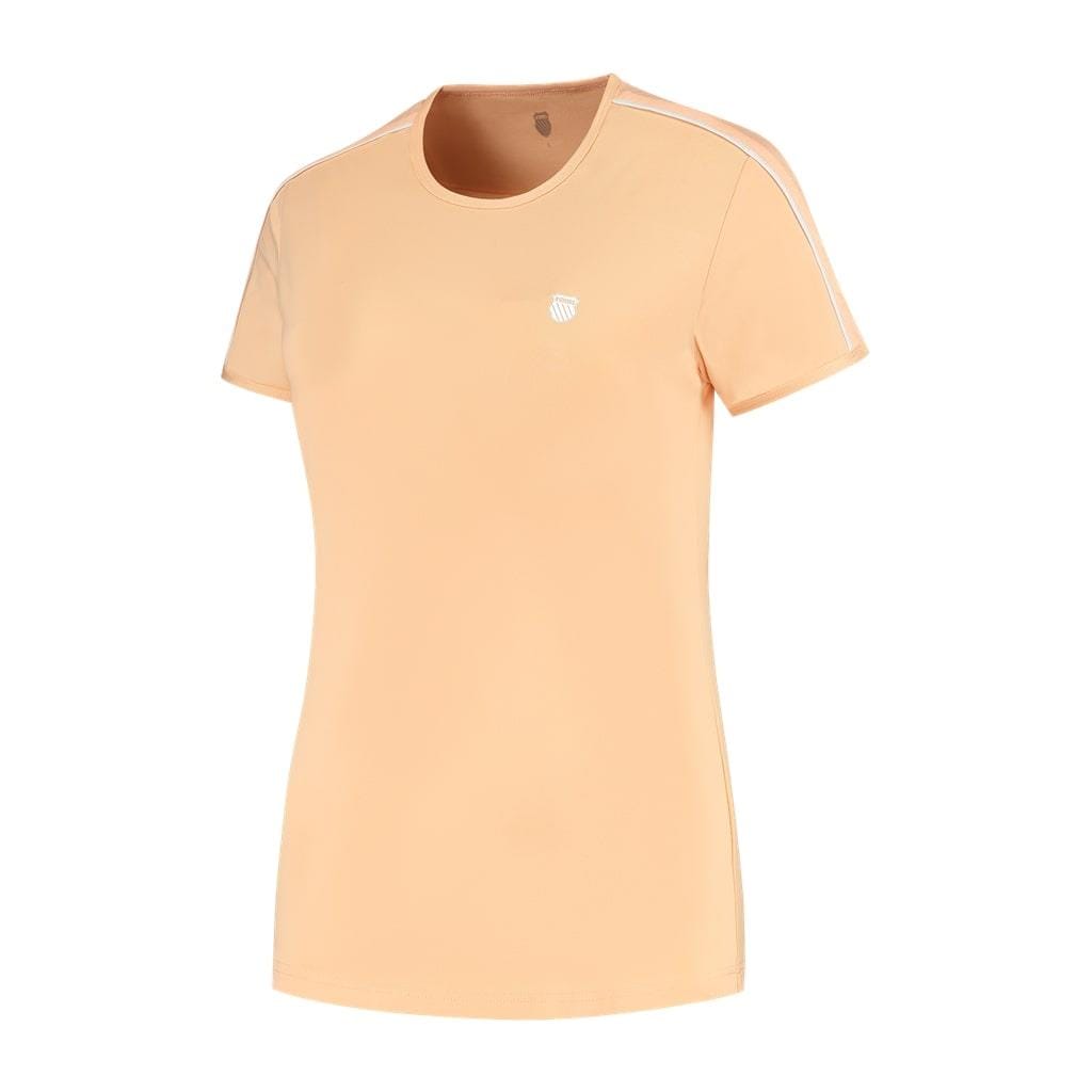 The K-Swiss Hypercourt Crew Tee 3 Women's Badminton T-Shirt in Peach Fuzz is a women's T-shirt featuring short sleeves and a round neckline. It boasts stylish white stripes along the shoulders and includes a small white circular emblem on the left chest for added comfort and style.