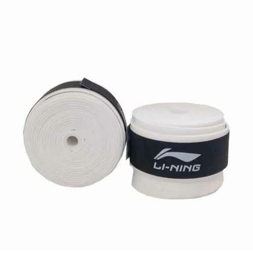 The image displays two rolls of the Li-Ning Badminton Overgrip in white. One roll is positioned upright while the other lies flat. The overgrips incorporate absorbent grip technology and are held together with black straps showcasing the Li-Ning logo, ensuring they maintain their tackiness for peak performance.