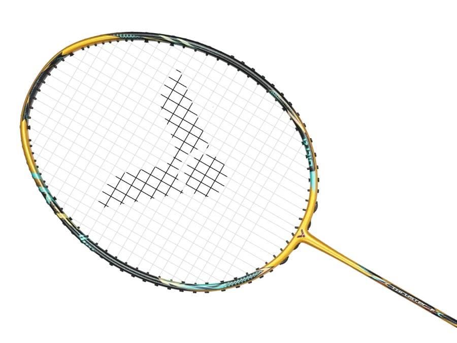 The Victor Thruster F C Ultra X Badminton Racket - Gold by Victor features a head heavy balance and displays a black three-shape logo on the strings, set against a white background.