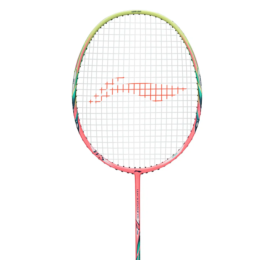 The Li-Ning Windstorm 72 Speed 6U Badminton Racket in light pink features a pink and green frame, red Li-Ning logo on white strings, and lightweight TB Nano Technology, shown against a plain white background.
