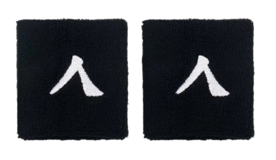 The Kanso 7cm Wristband - 2 Pack offers two black wristbands with a white abstract symbol resembling a stylized letter, crafted from absorbent fabric for maximum comfort, elegantly highlighted on a simple white backdrop.