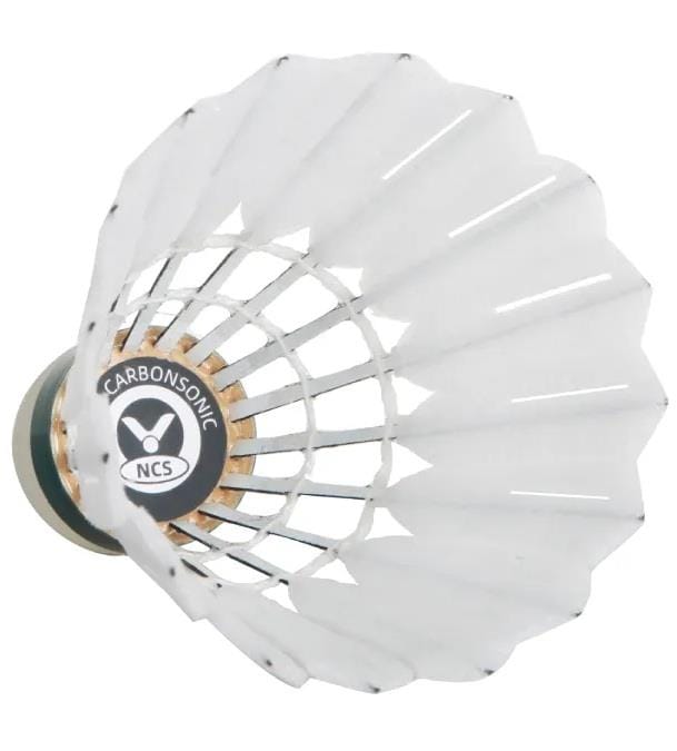 A close-up view of a Victor New Carbonsonic NCS Badminton Shuttlecock from Victor, a synthetic feather shuttlecock with "CARBONSONIC NCS" on its black base. The feather details and structure are clearly visible. Set of 12 shuttlecocks.